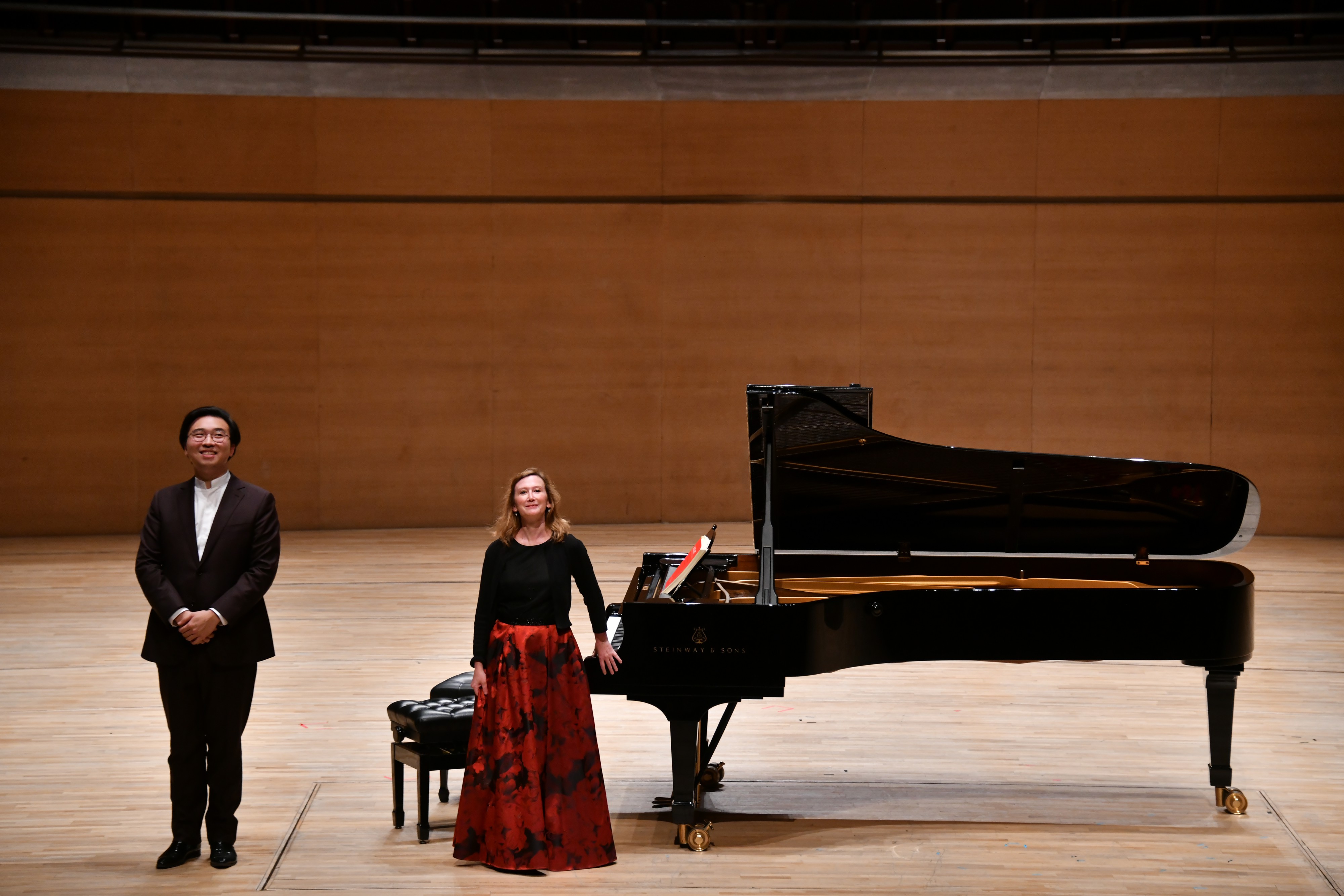 Audrey Axinn with pianist and Tianjin Juilliard resident faculty, Alvin Zhu, performing at The Tianjin Grand Theatre in China. Photo credit: Duan Chao
