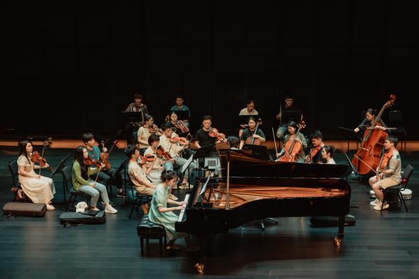 TJPF participant rehearsing with orchestra
