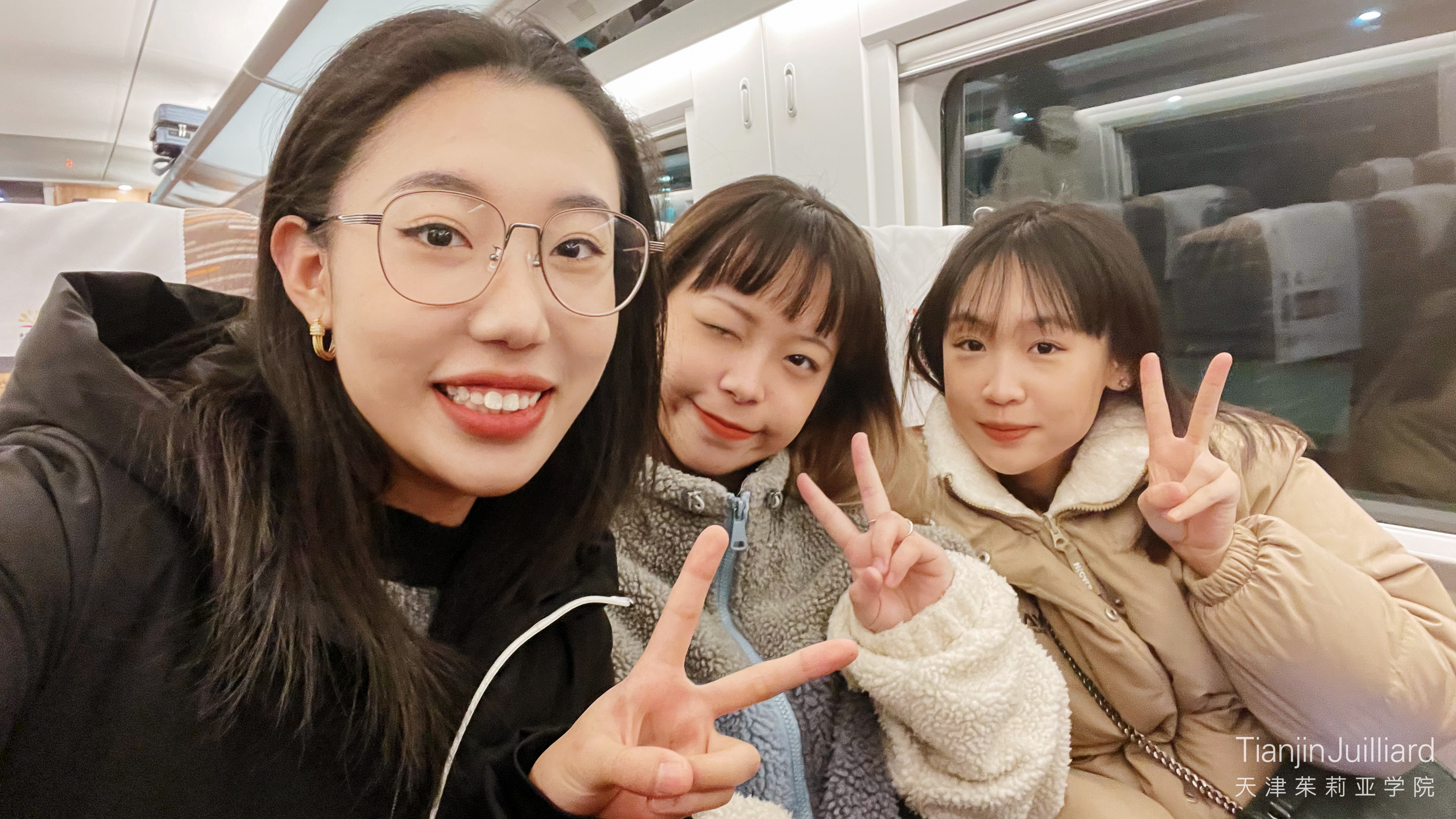 Students on the high-speed train between Tianjin and Beijing