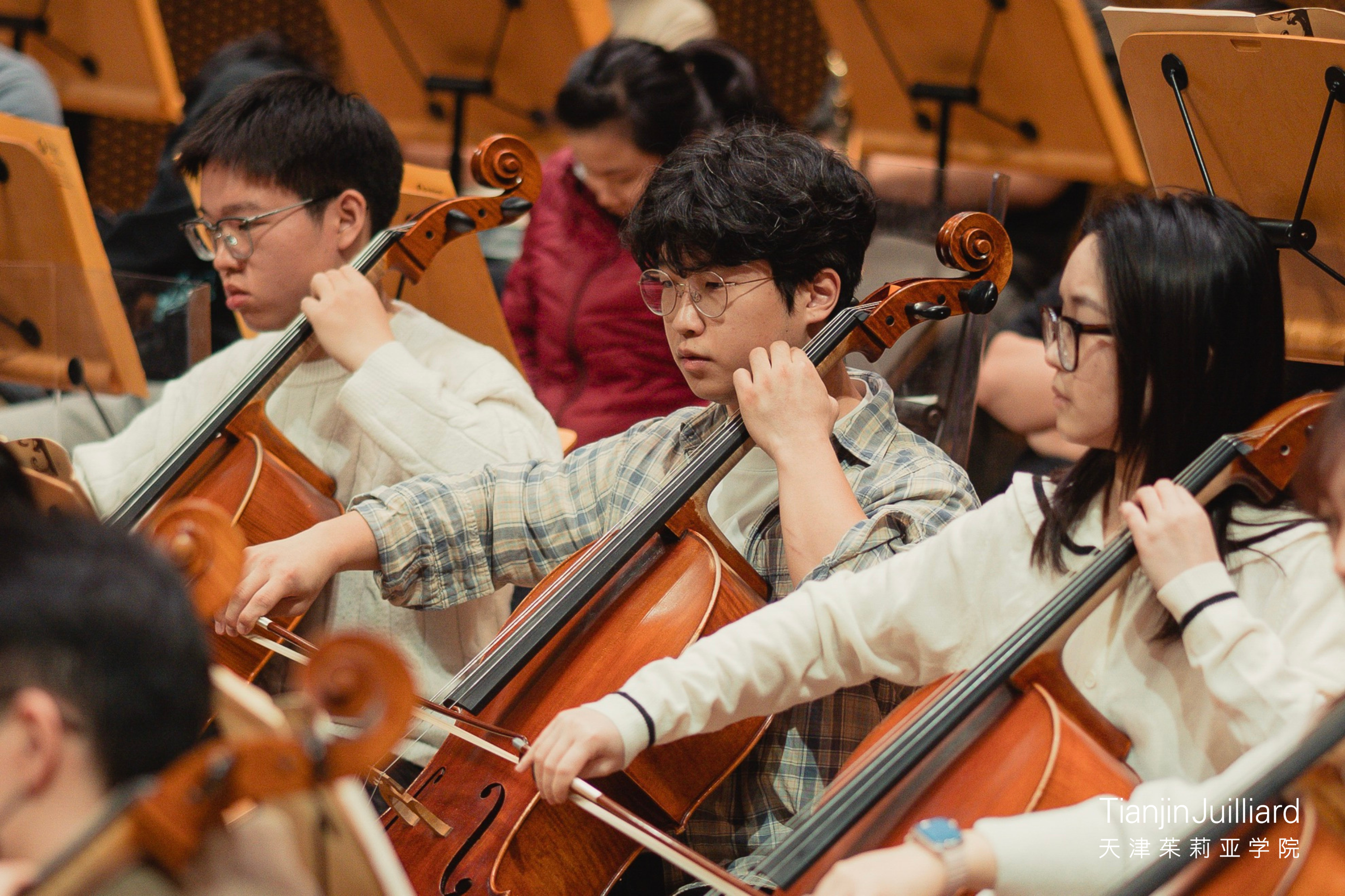 Brian (center) at a Tianjin Juilliard Orchestra rehearsal in March 2025.