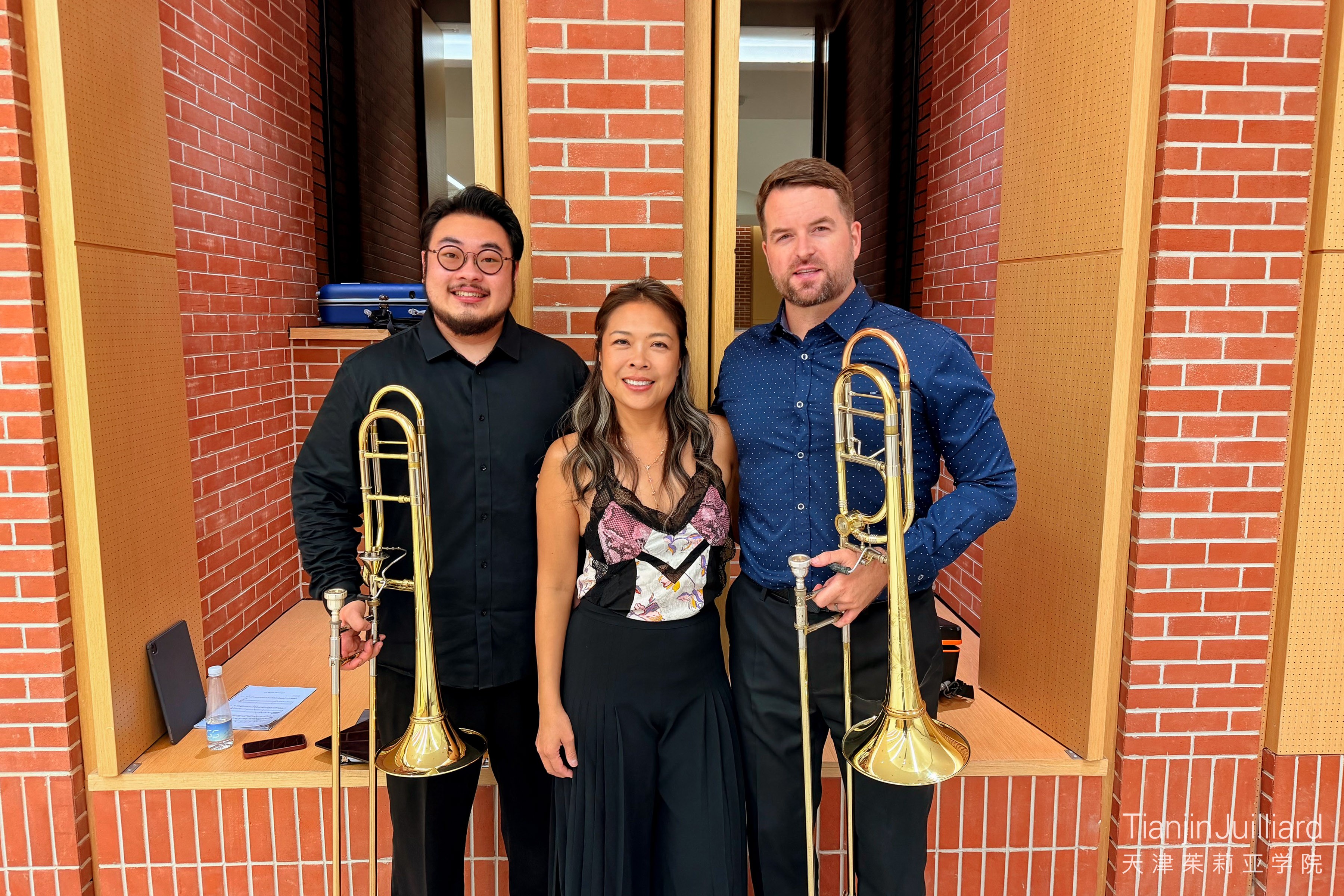 (From right to left) Lee, Allie, and Pre-College alumnus Charlie Cao at the 5th Beijing International Brass Festival in August 2026.