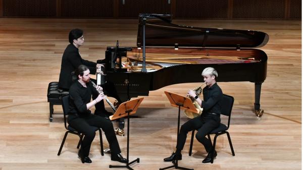 Jordan Dale (MM'23, Oboe), Jaben Sim (MM'23, Horn) and Baoshuai Yan (MM'22, Piano) performing Carl Reinecke's Trio for Oboe, Horn, and Piano in a minor op. 188, at the Tianjin Juilliard Concert Hall.