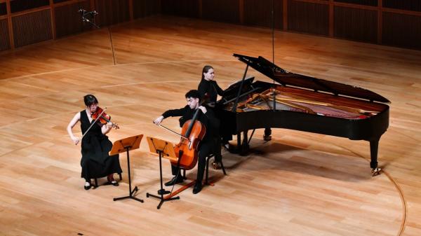 Zhiyi Dong (MM'23, Violin), Nathaniel Blowers (MM'23, Cello) and Polina Charnetskaia (MM'23, Piano) performing Johannes Brahms's Piano Trio No. 2 in C Major, Op. 87. 