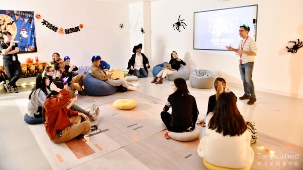 Diego giving a presentation about "Day of the Dead” traditions at a Tianjin Juilliard Halloween event.