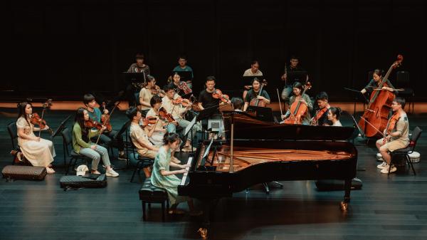 TJPF participant rehearsing with orchestra