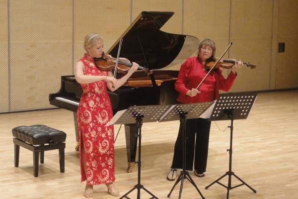 Julia Glenn performing at a concert in China