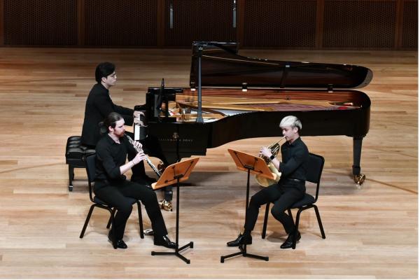 Jordan Dale (MM'23, Oboe), Jaben Sim (MM'23, Horn) and Baoshuai Yan (MM'22, Piano) performing Carl Reinecke's Trio for Oboe, Horn, and Piano in a minor op. 188, at the Tianjin Juilliard Concert Hall.