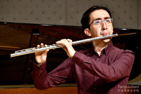 Tianjin Juilliard graduate student Diego Acosta performing in a flute studio recital